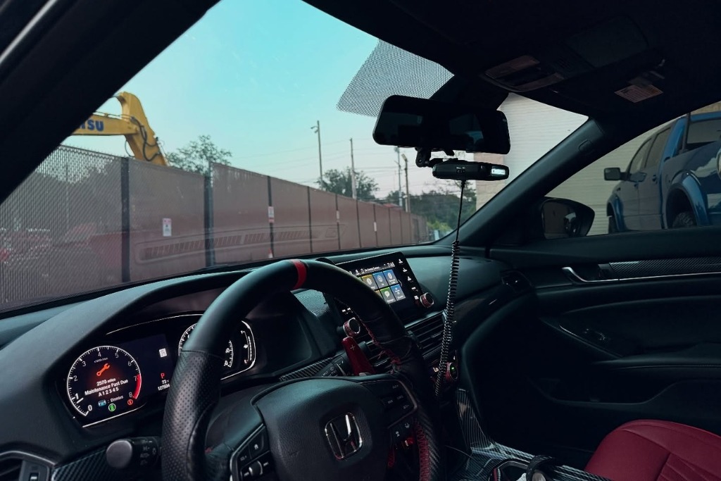 Interior view of a tinted Honda vehicle in Staten Island, showcasing the benefits of car window tinting by Exclusive Window Tinting NYC, including glare reduction, UV protection, and enhanced cabin comfort.